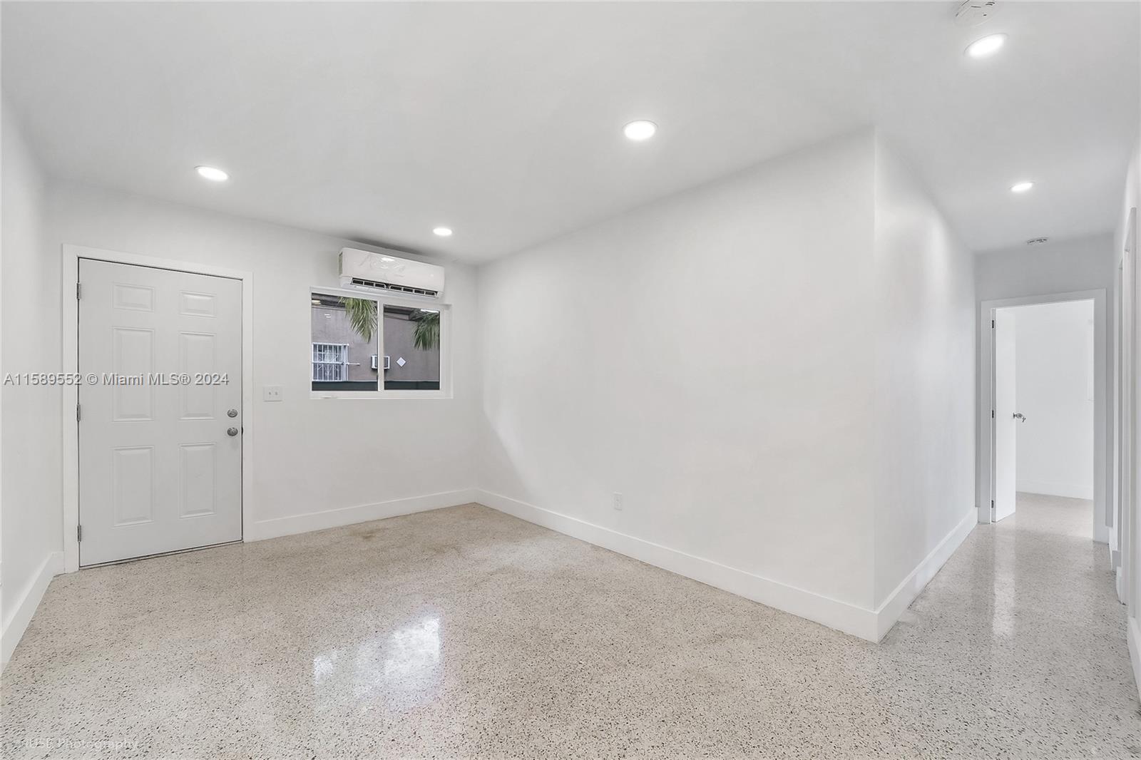 2130 Northwest 28th Street Miami, FL 33142 - Photo 40 of 48 en empty room with windows and closet