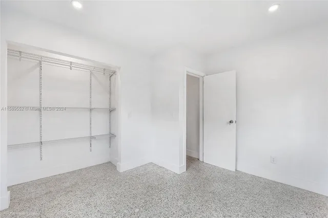 a kitchen with stainless steel appliances granite countertop a refrigerator sink and cabinets