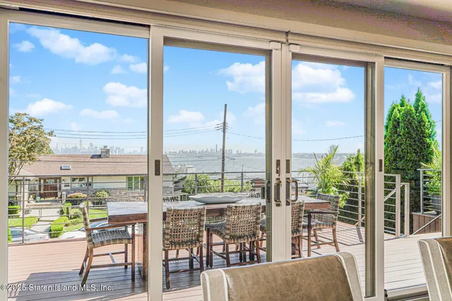 a kitchen that has a lot of cabinets in it and wooden floors