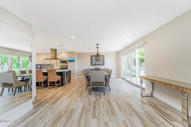 a kitchen with a stove a table and chairs