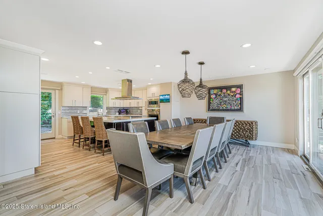 a kitchen with a stove a table and chairs
