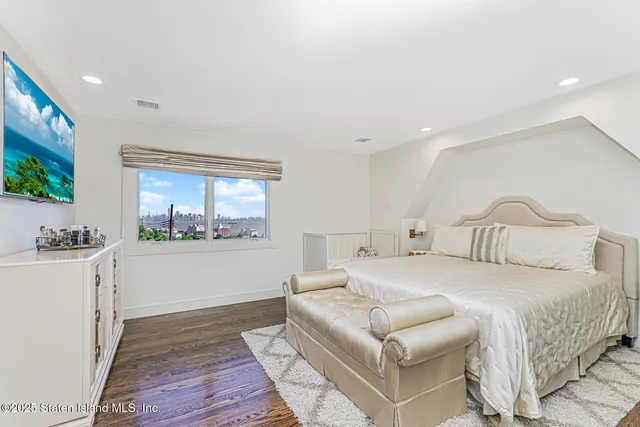 a view of a table and chairs under an umbrella in backyard