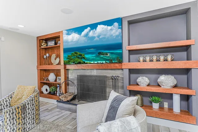 a dining room with furniture a chandelier and large windows
