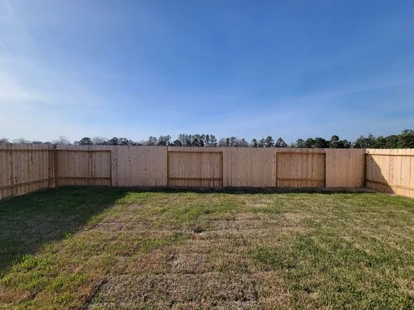 a house view with a backyard space