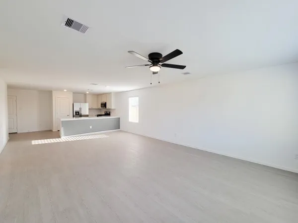 a view of a livingroom with a kitchen