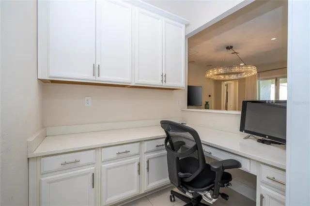 a kitchen with stainless steel appliances granite countertop a refrigerator sink and white cabinets