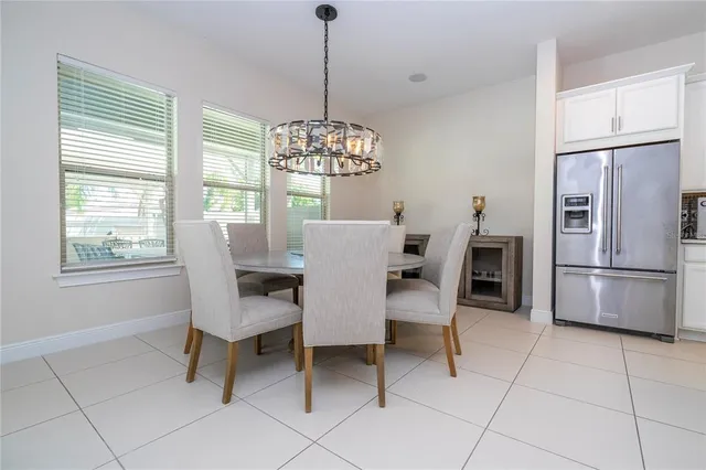 a view of a dining room with furniture window and outside view