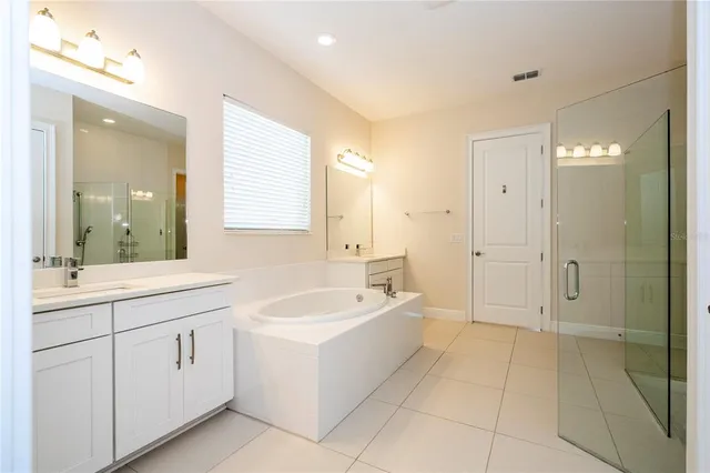a bathroom with a toilet sink and a shower