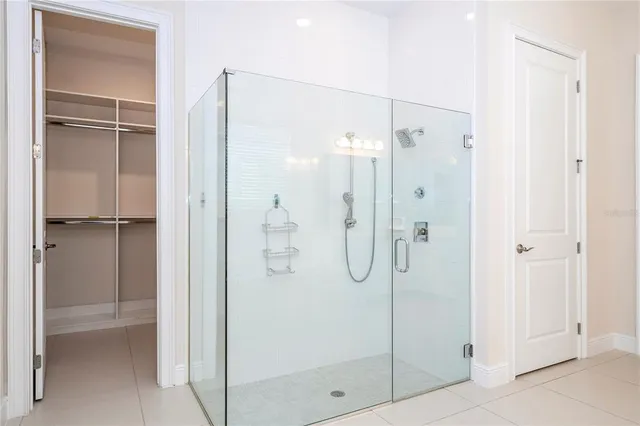 a room with a bed and a painting on the wall