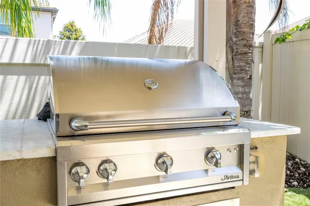 an aerial view of residential houses with outdoor space and lake view