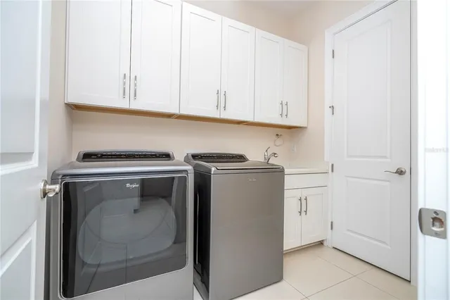 a view of swimming pool with outdoor seating and a yard