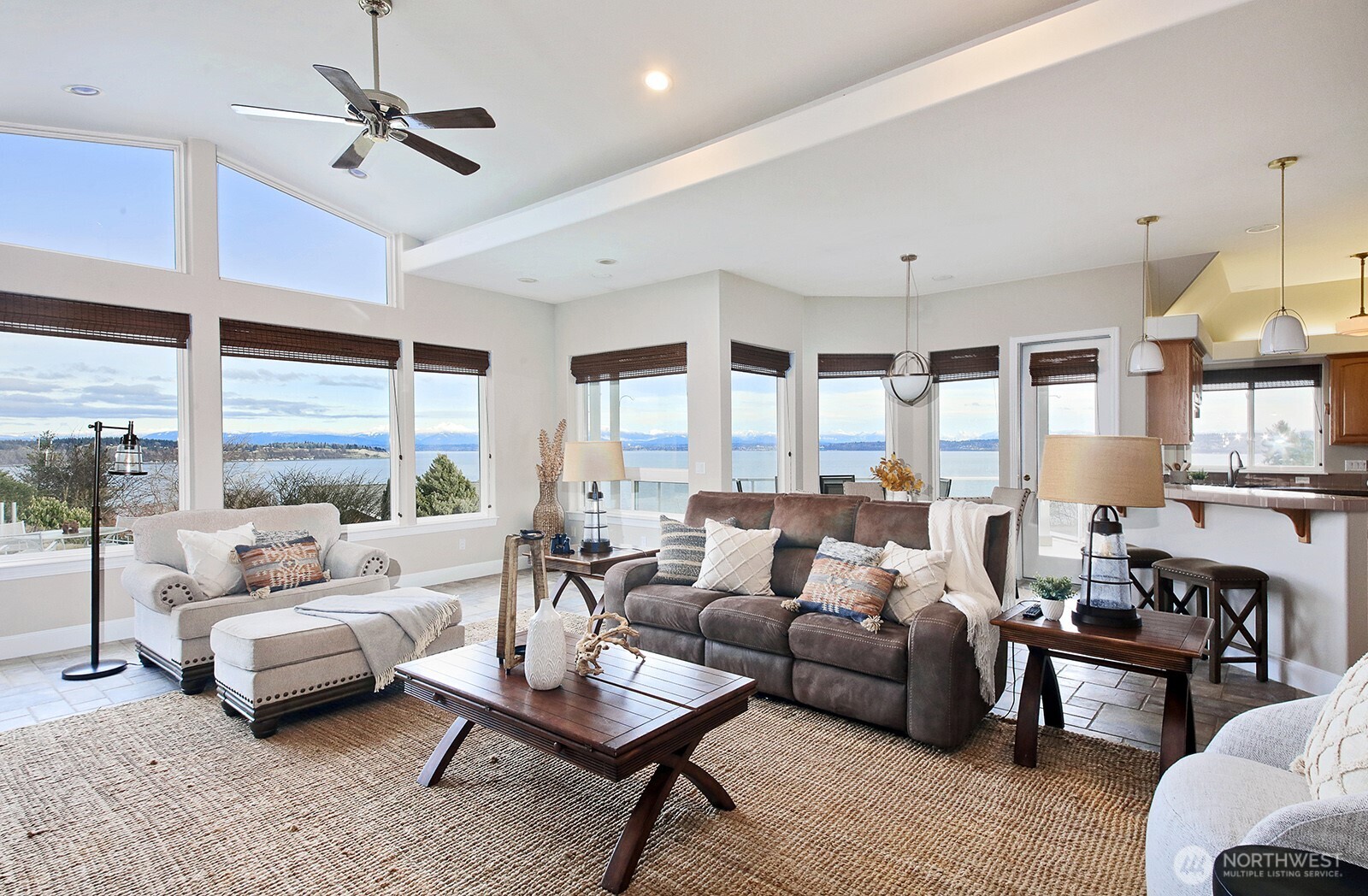 4694 Wrightsman Place Clinton, WA 98236 - Photo 4 of 38 a living room with furniture ceiling fan and a large window