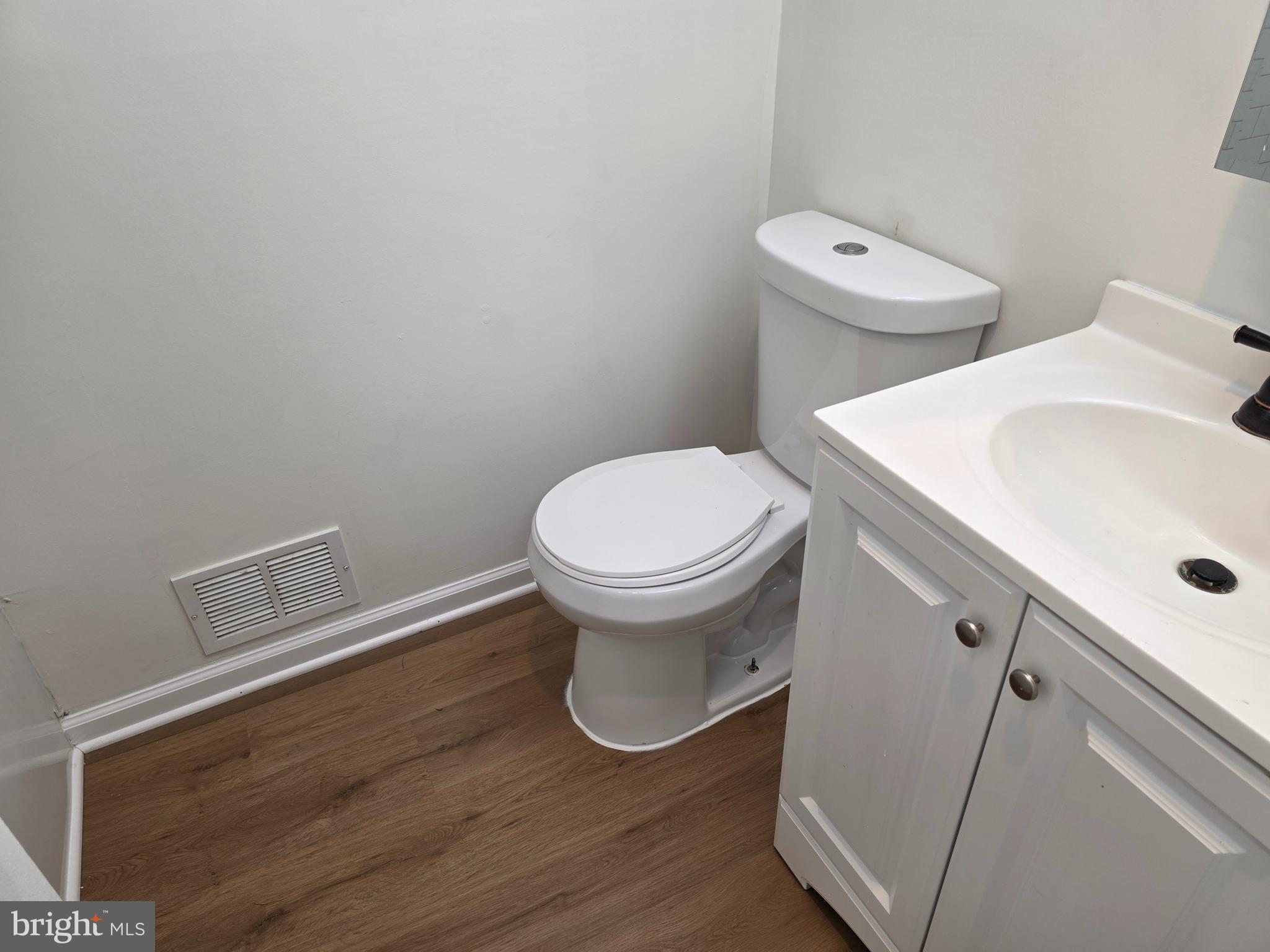 11 Guild Court Willingboro, NJ 08046 - Photo 15 of 16 a white toilet sitting next to a white sink and vanity