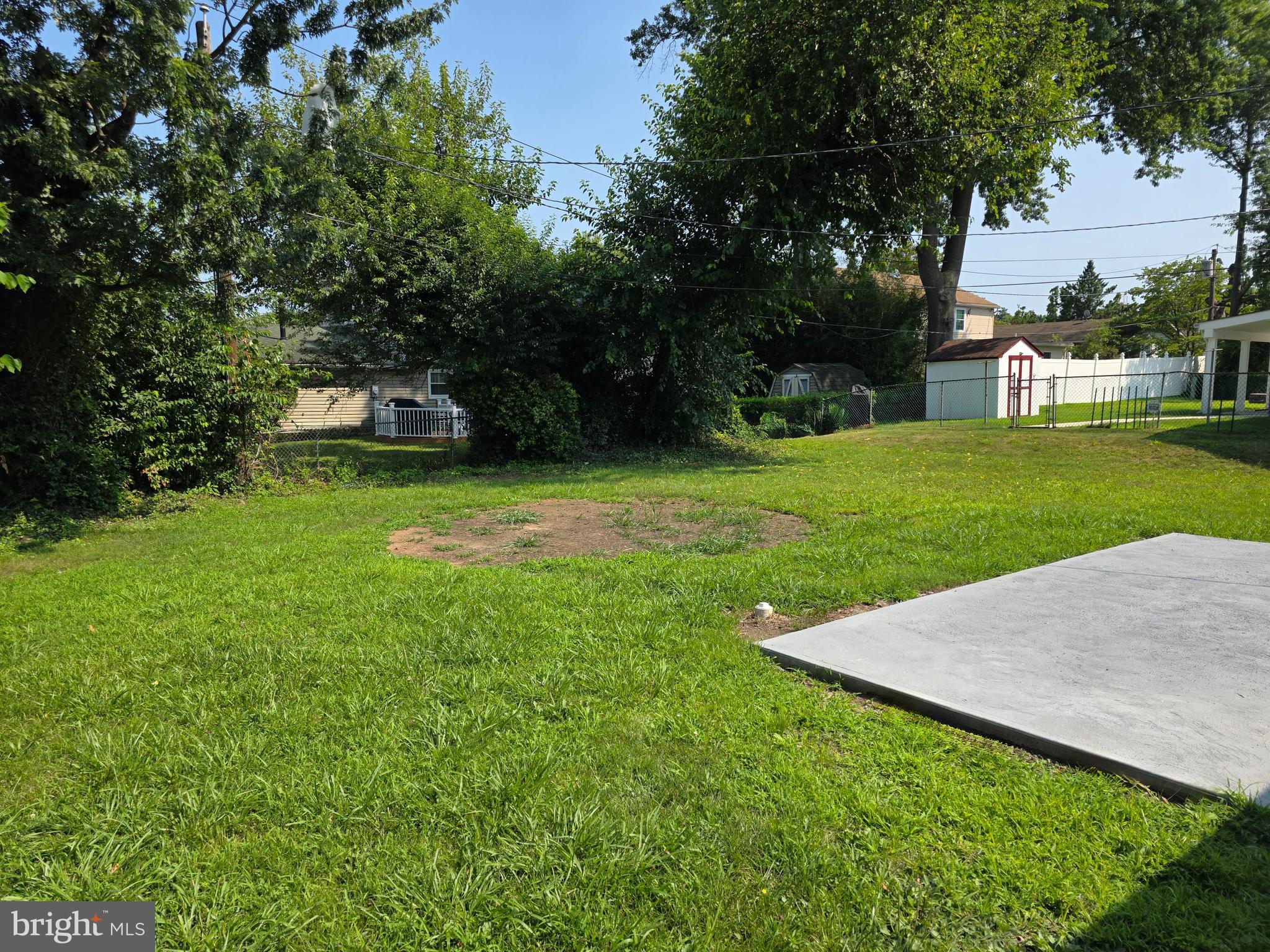 11 Guild Court Willingboro, NJ 08046 - Photo 5 of 16 a view of a backyard with a garden and trees