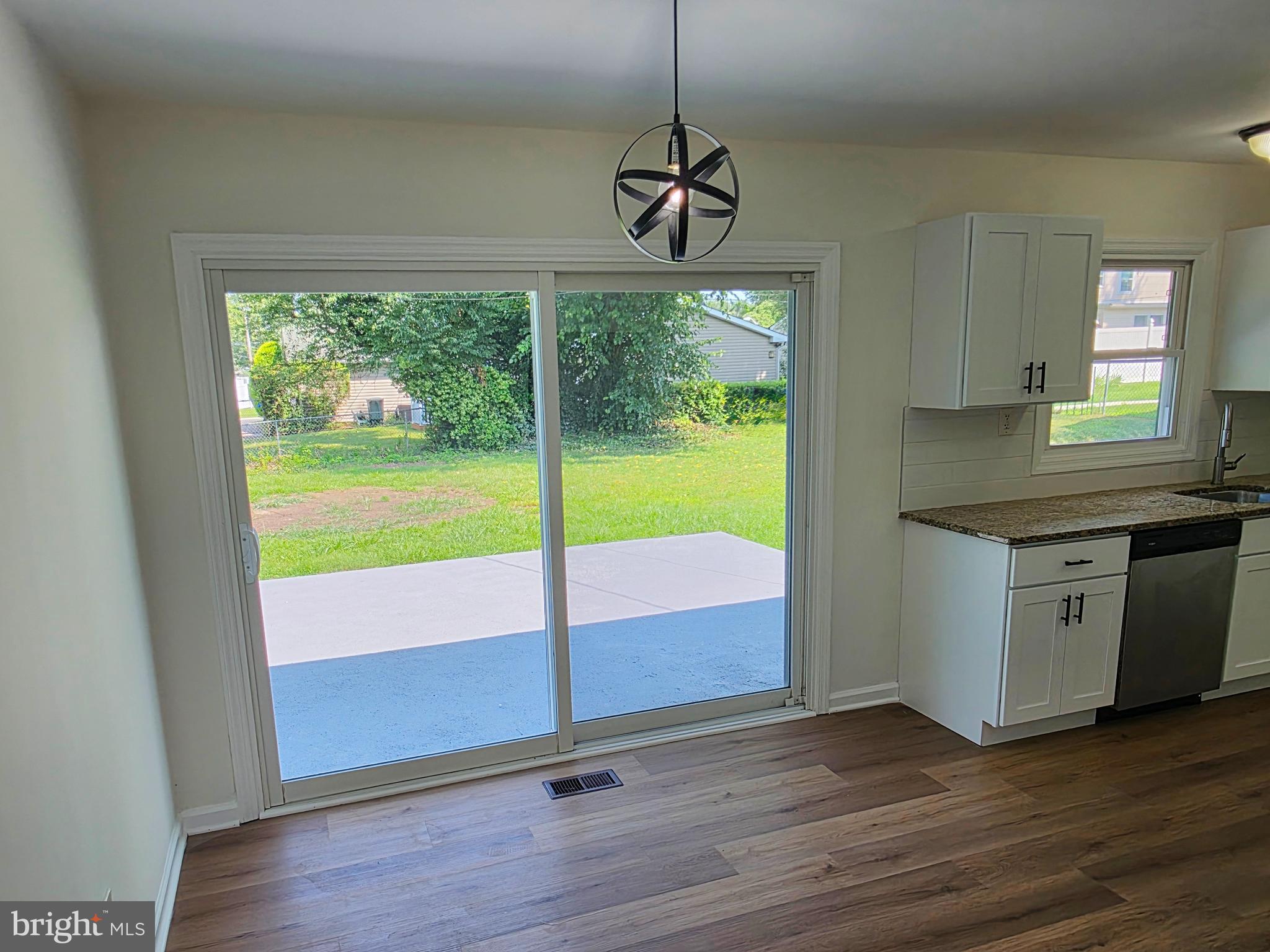 11 Guild Court Willingboro, NJ 08046 - Photo 8 of 16 a kitchen with a wooden floor and a window