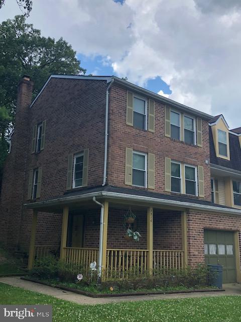 7516 Mandan Road Greenbelt, MD 20770 - Photo 1 of 15 a brick building that has lots of windows in it