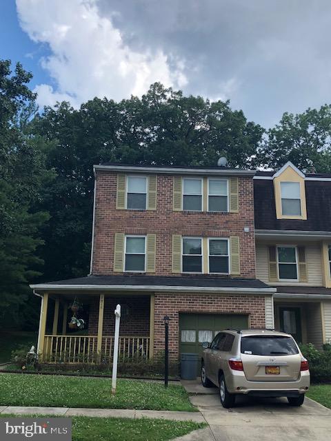 7516 Mandan Road Greenbelt, MD 20770 - Photo 2 of 15 a car parked in front of a house