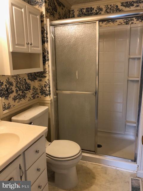7516 Mandan Road Greenbelt, MD 20770 - Photo 15 of 15 a bathroom with a sink toilet and shower