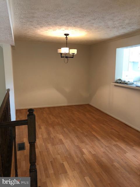 7516 Mandan Road Greenbelt, MD 20770 - Photo 7 of 15 a view of a room with wooden floor