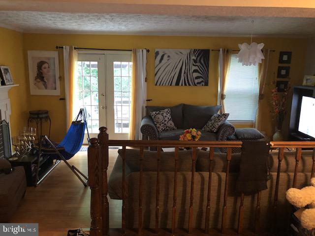 7516 Mandan Road Greenbelt, MD 20770 - Photo 9 of 15 a living room with furniture and wooden floor