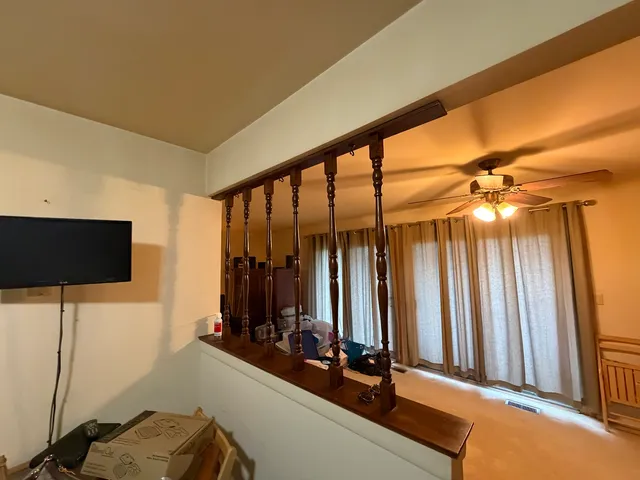 a room with gym equipment and a flat screen tv