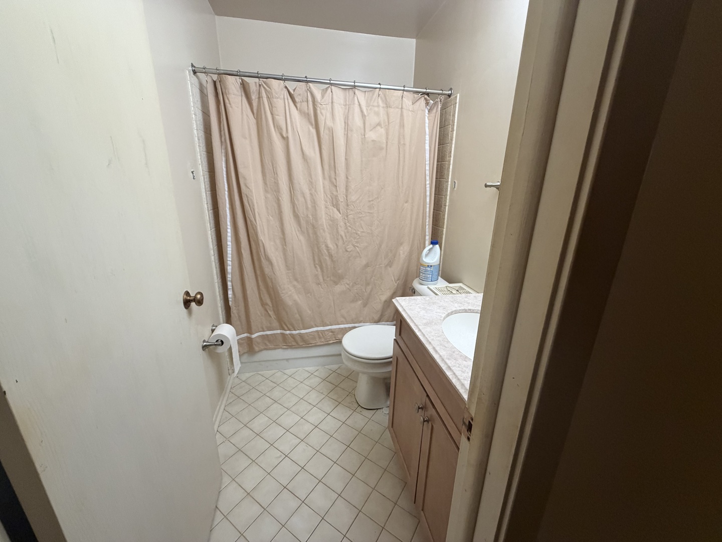 5149 Coventry Lane, Unit 6B1 Gurnee, IL 60031 - Photo 15 of 19 a bathroom with a sink a toilet and shower curtain