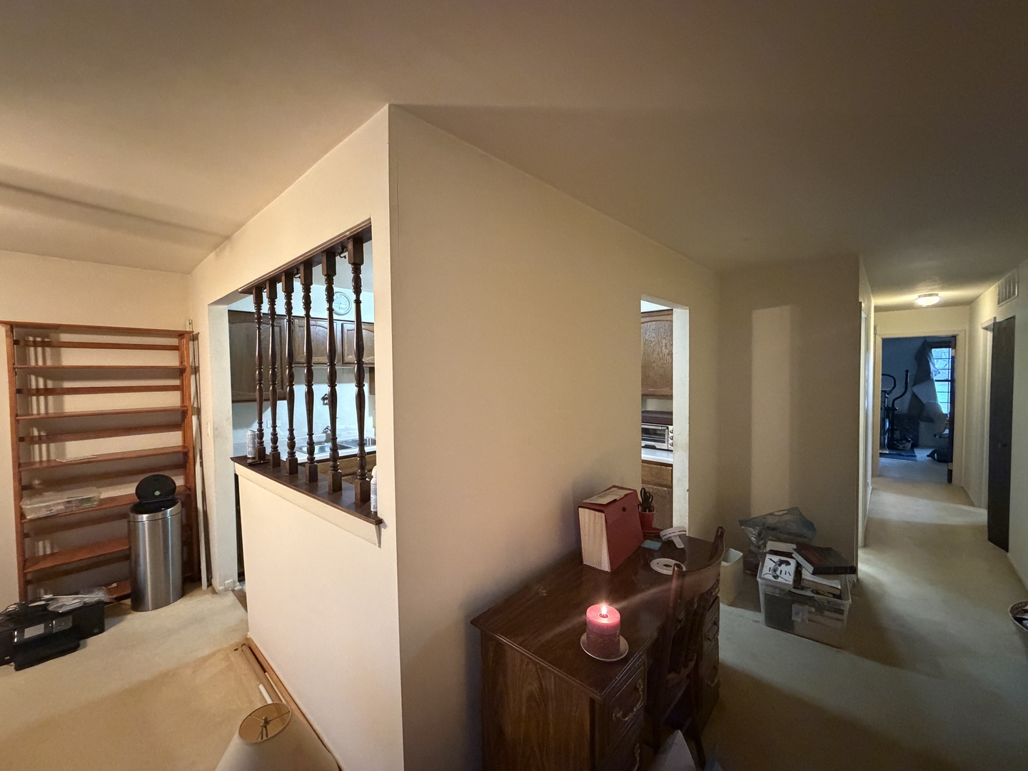 5149 Coventry Lane, Unit 6B1 Gurnee, IL 60031 - Photo 6 of 19 a hallway with a white stove top oven and couches with wooden floor