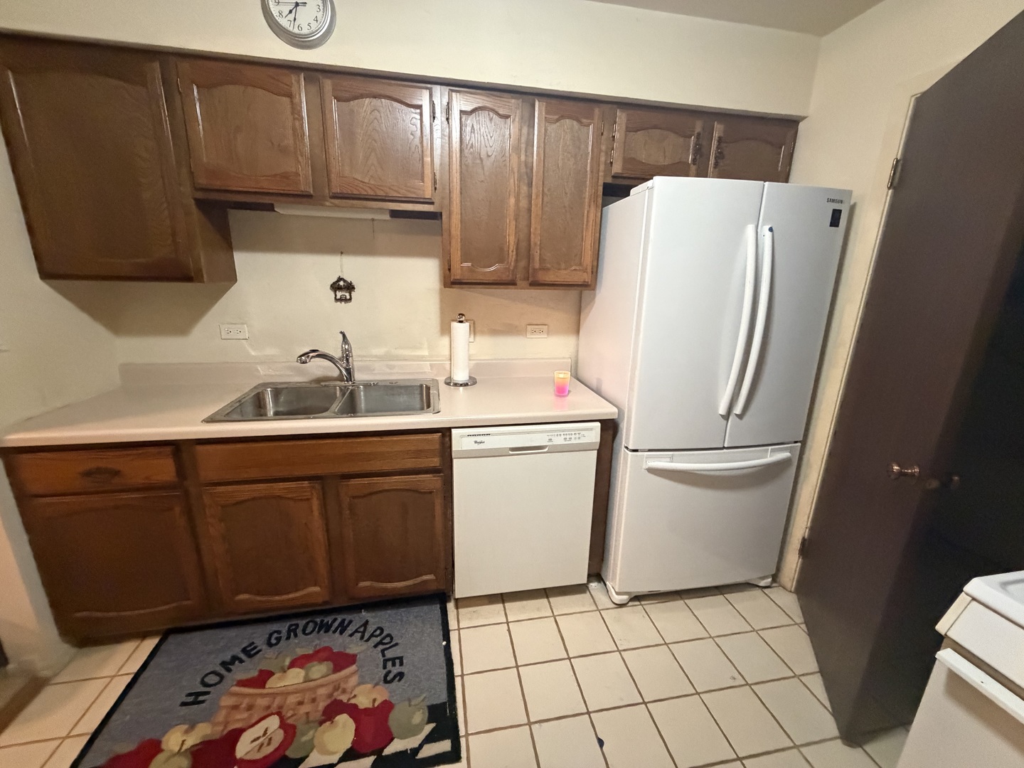 5149 Coventry Lane, Unit 6B1 Gurnee, IL 60031 - Photo 8 of 19 a kitchen with a refrigerator sink and cabinets