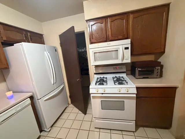 a kitchen with a stove microwave and refrigerator