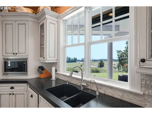 a kitchen with a sink and a window