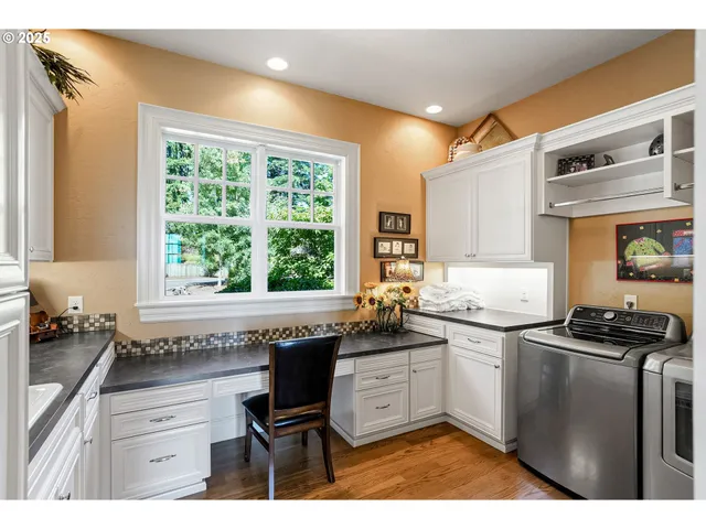 a kitchen with a sink stove top oven and cabinets