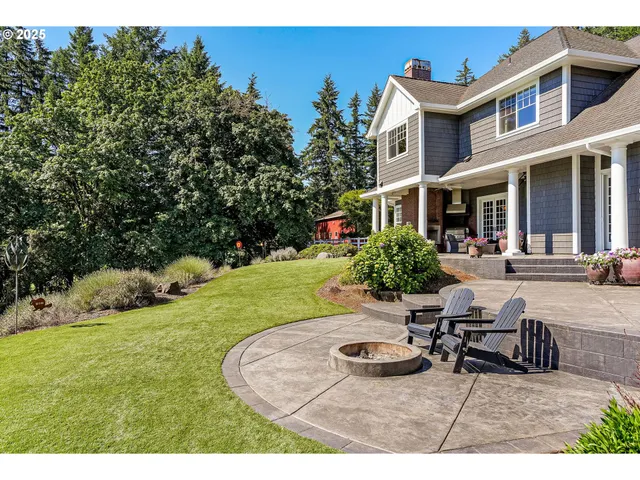 a view of a house with backyard porch and sitting area