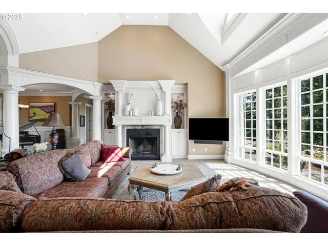 a living room with furniture and a fireplace