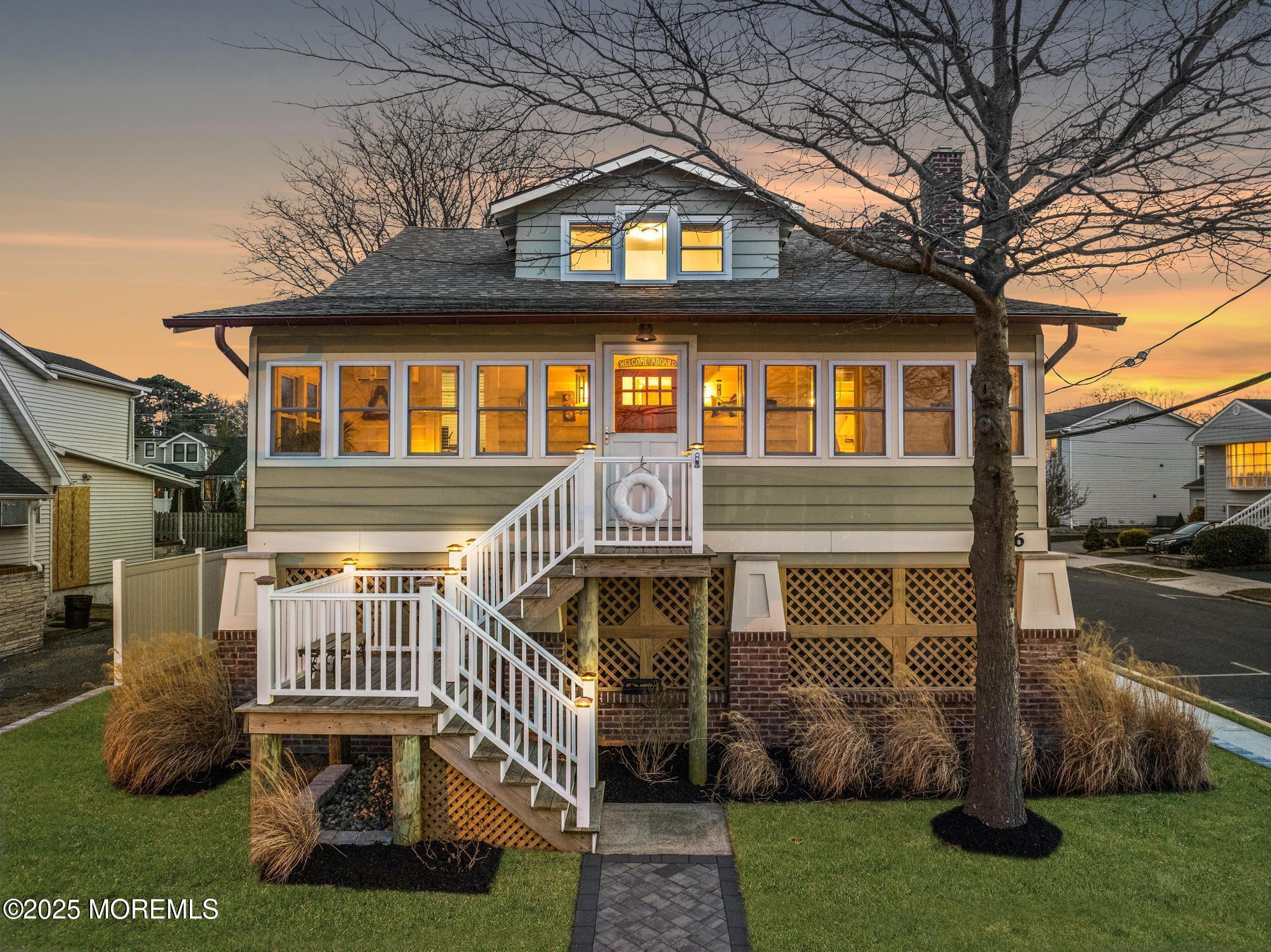 1206 River Road Belmar, NJ 07719 - Photo 1 of 36 a front view of a house with a yard