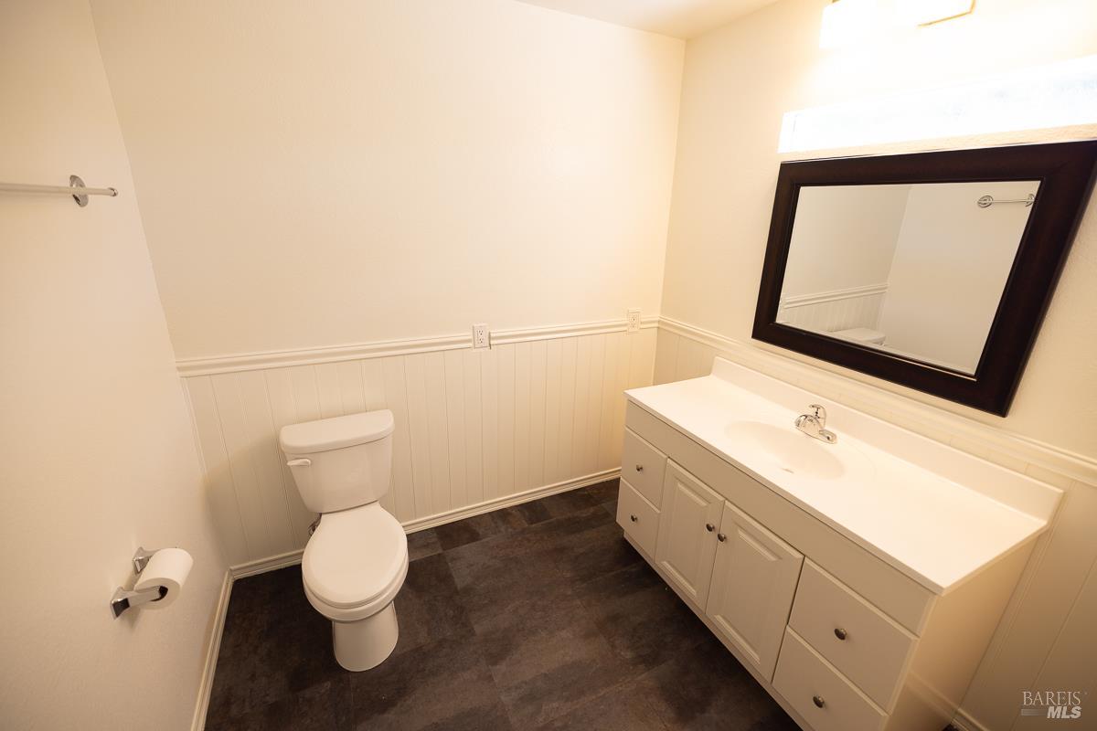 1685 West College Avenue Santa Rosa, CA 95401 - Photo 15 of 45 a bathroom with a toilet sink and mirror
