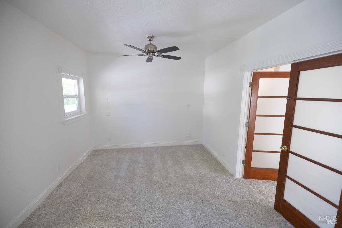 1685 West College Avenue Santa Rosa, CA 95401 - Photo 16 of 45 wooden floor in an empty room with a window
