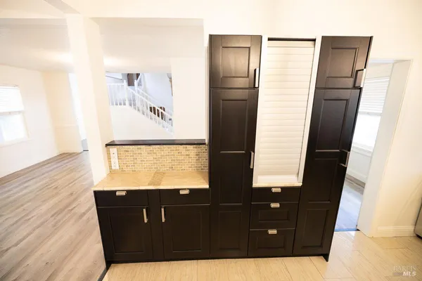 a kitchen with a sink and a stove