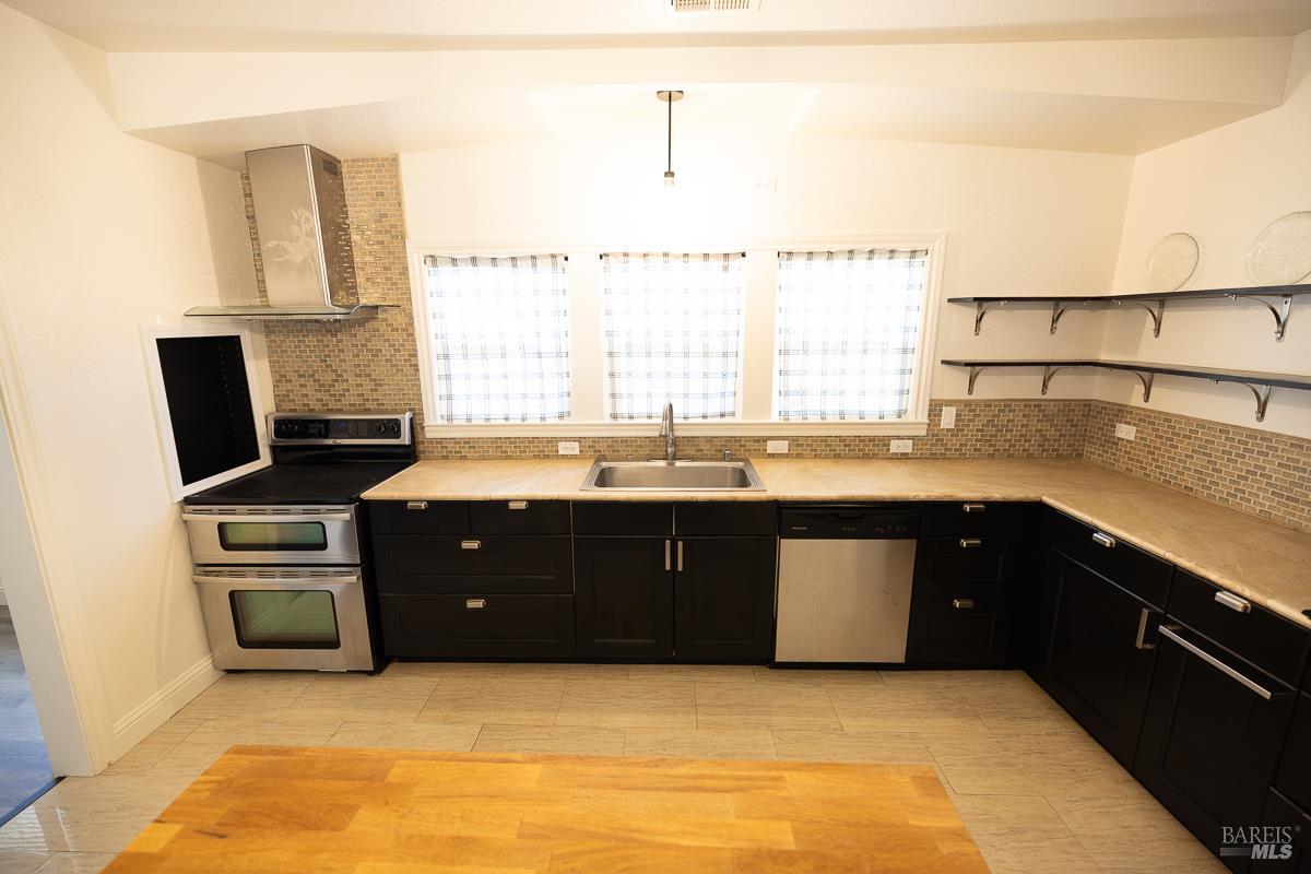 1685 West College Avenue Santa Rosa, CA 95401 - Photo 21 of 45 a kitchen with a sink and a stove