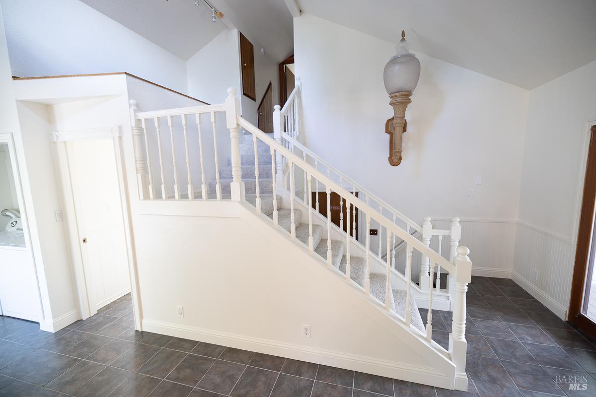 1685 West College Avenue Santa Rosa, CA 95401 - Photo 27 of 45 a view of staircase with lots of frames on wall and shower