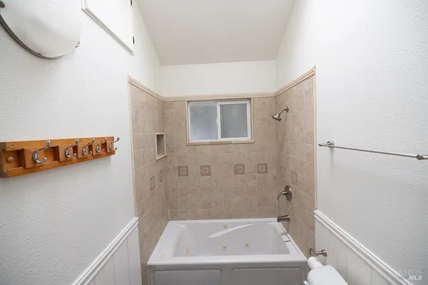 a bathroom with a sink vanity and mirror