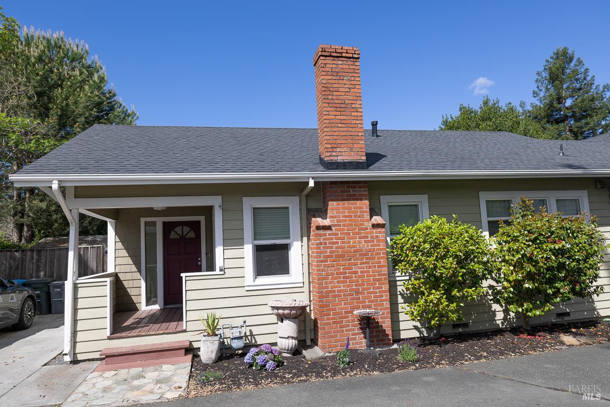 1685 West College Avenue Santa Rosa, CA 95401 - Photo 3 of 45 a front view of a house with a garden