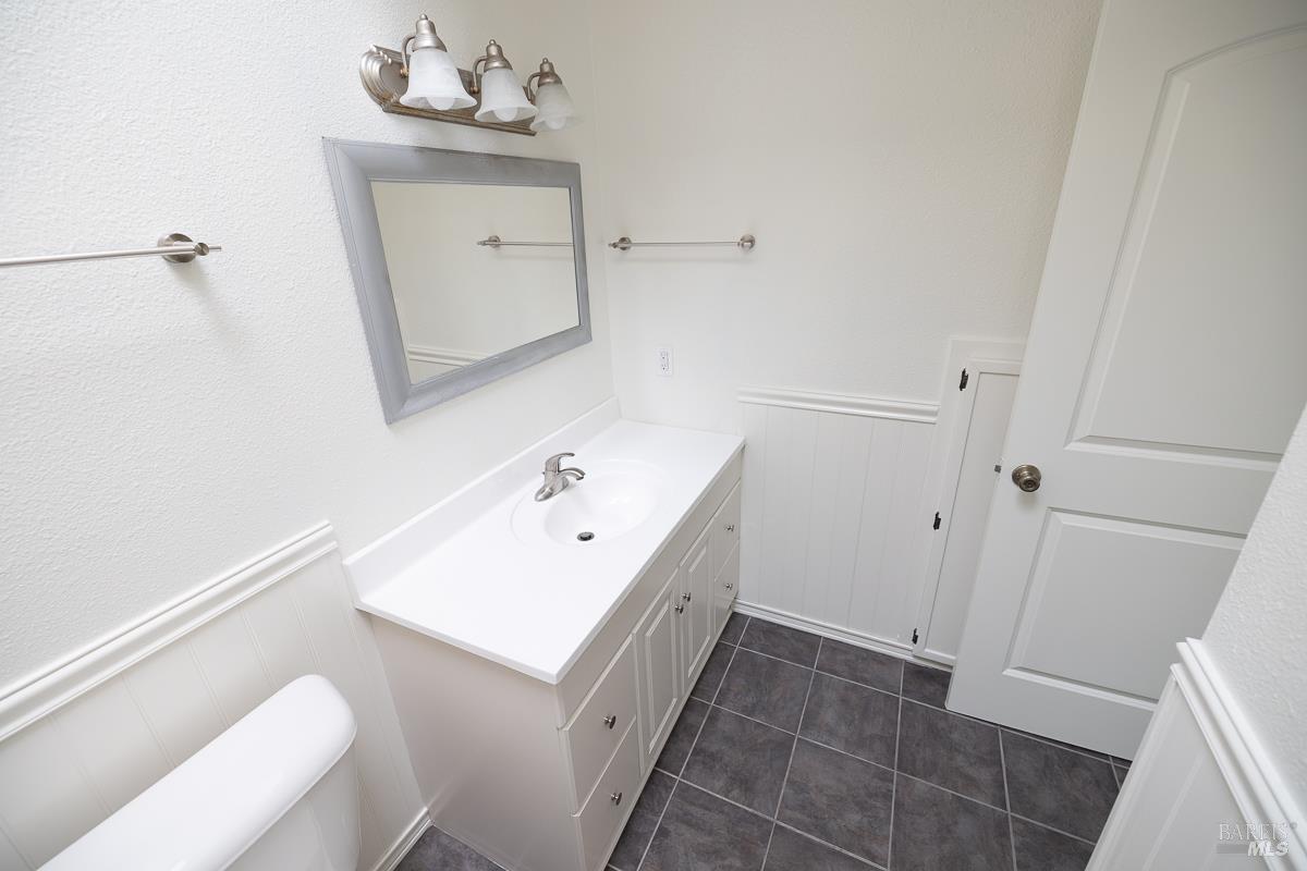 1685 West College Avenue Santa Rosa, CA 95401 - Photo 31 of 45 a bathroom with a sink vanity and mirror