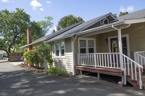 a view of a red door and wooden door