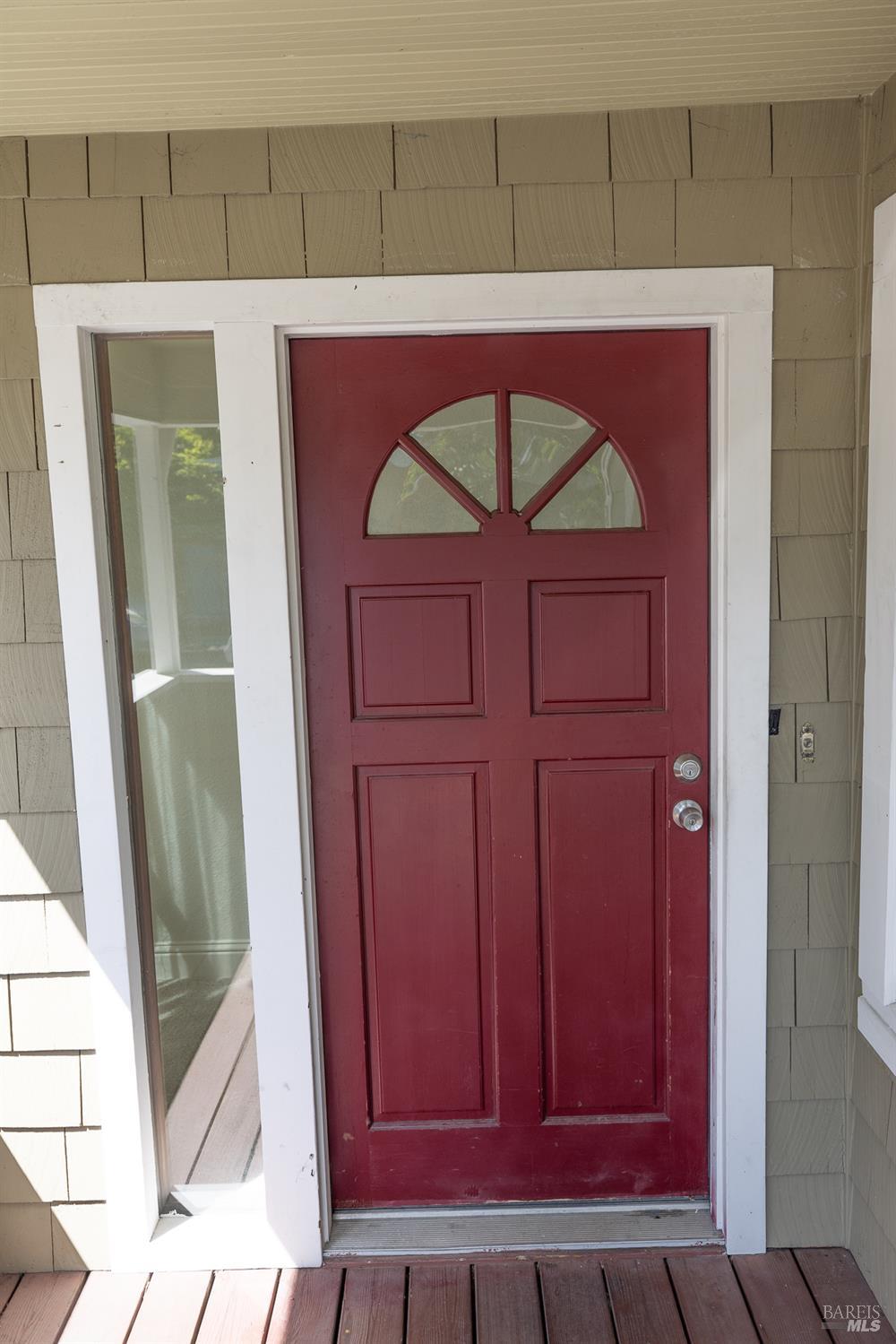 1685 West College Avenue Santa Rosa, CA 95401 - Photo 8 of 45 a view of a red door and wooden door