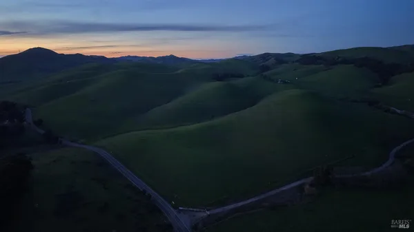 a view of a house with a mountain