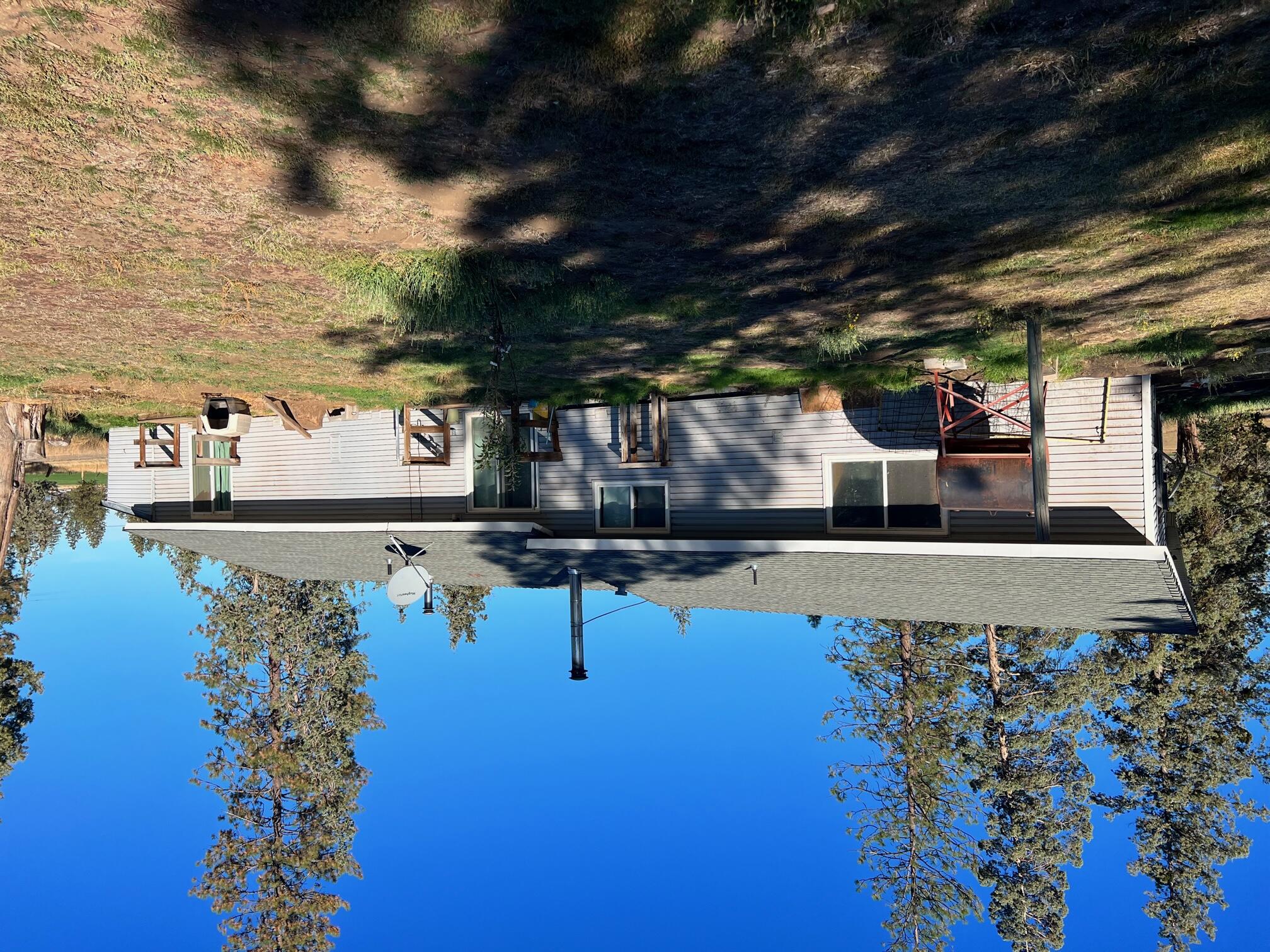 44619 Cornell Road Fall River Mills, CA 96028 - Photo 1 of 17 a view of a house with a patio