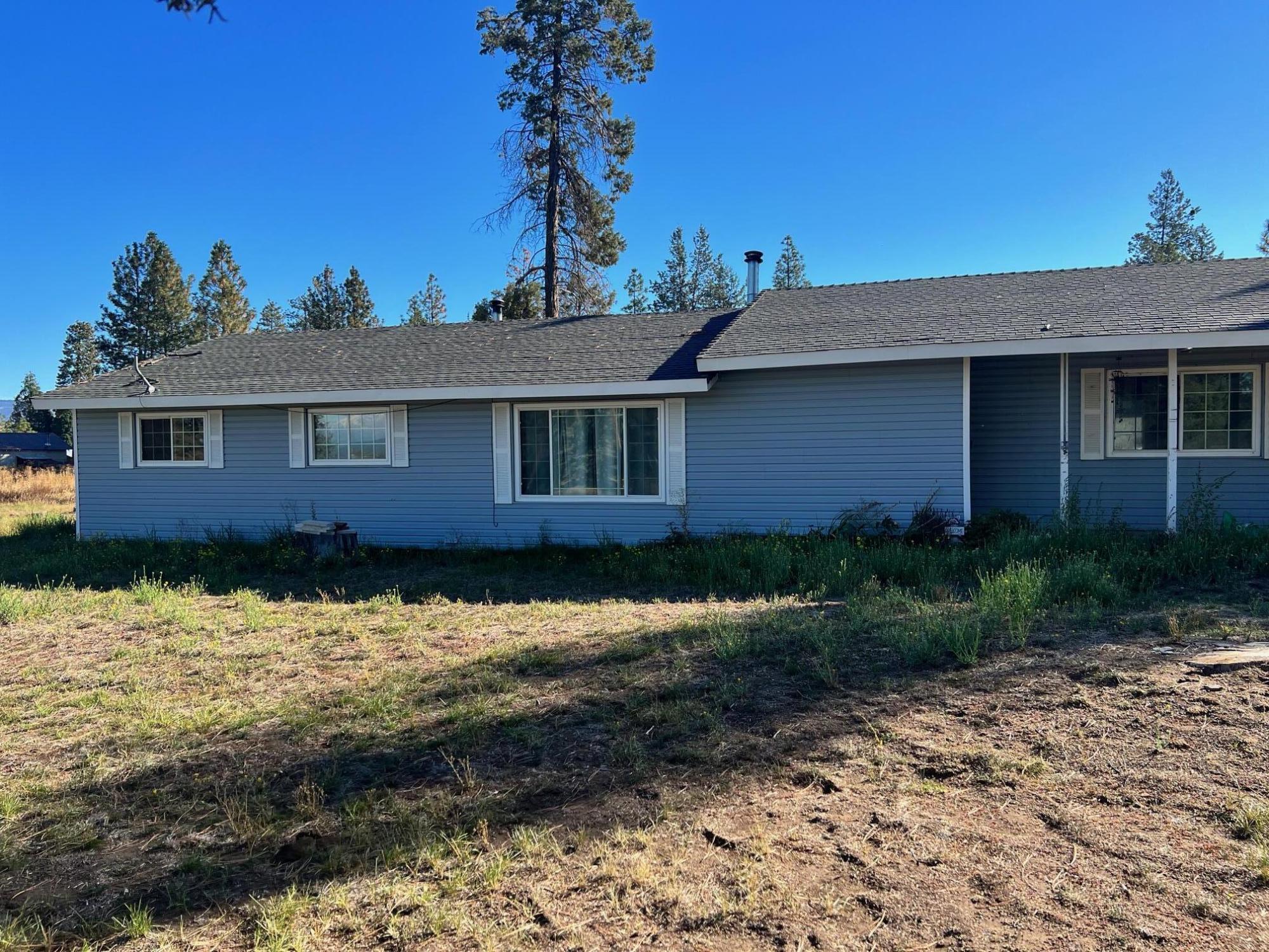 44619 Cornell Road Fall River Mills, CA 96028 - Photo 2 of 17 a front view of a house with a yard