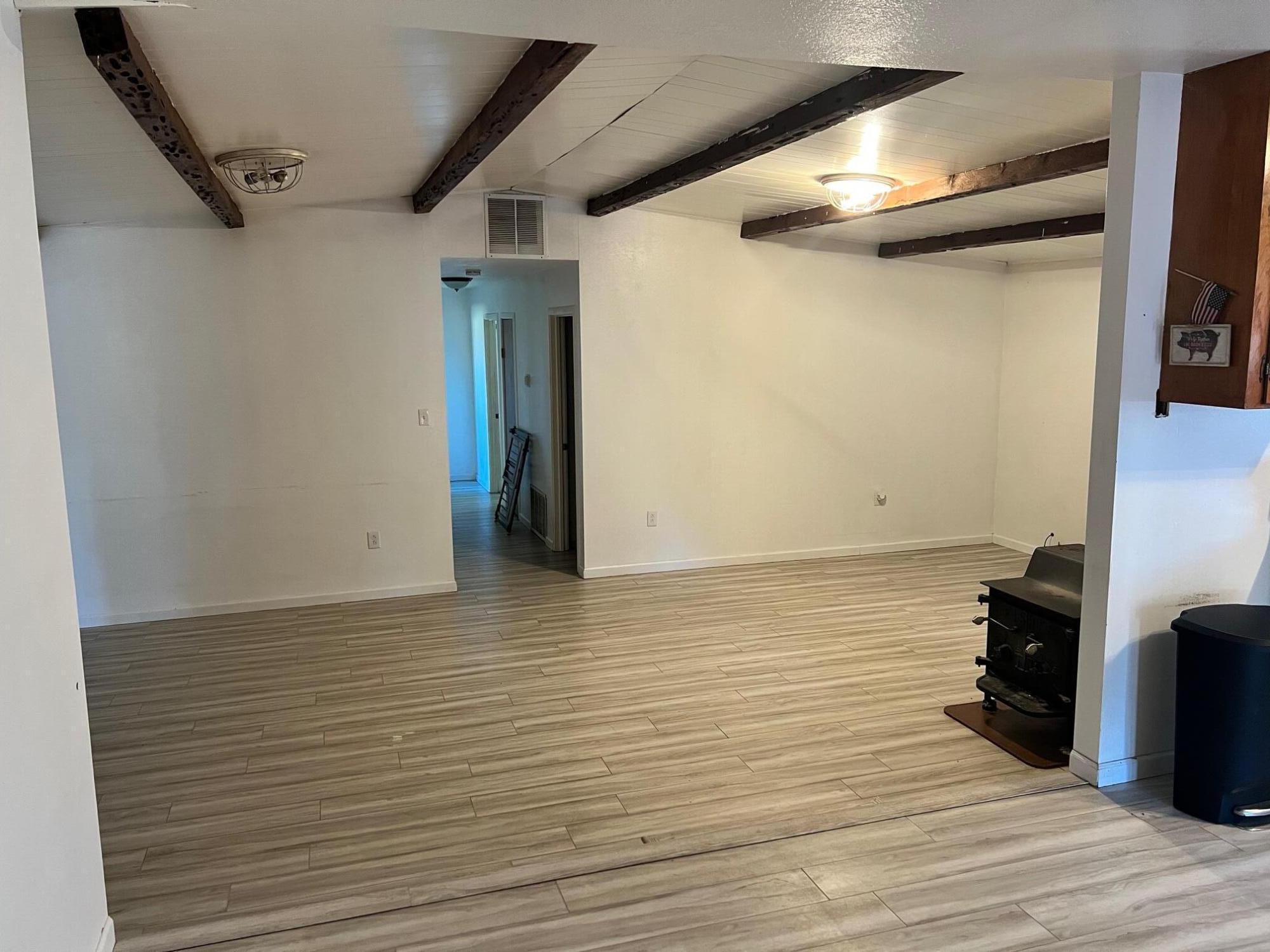 44619 Cornell Road Fall River Mills, CA 96028 - Photo 4 of 17 a view of an empty room with wooden floor