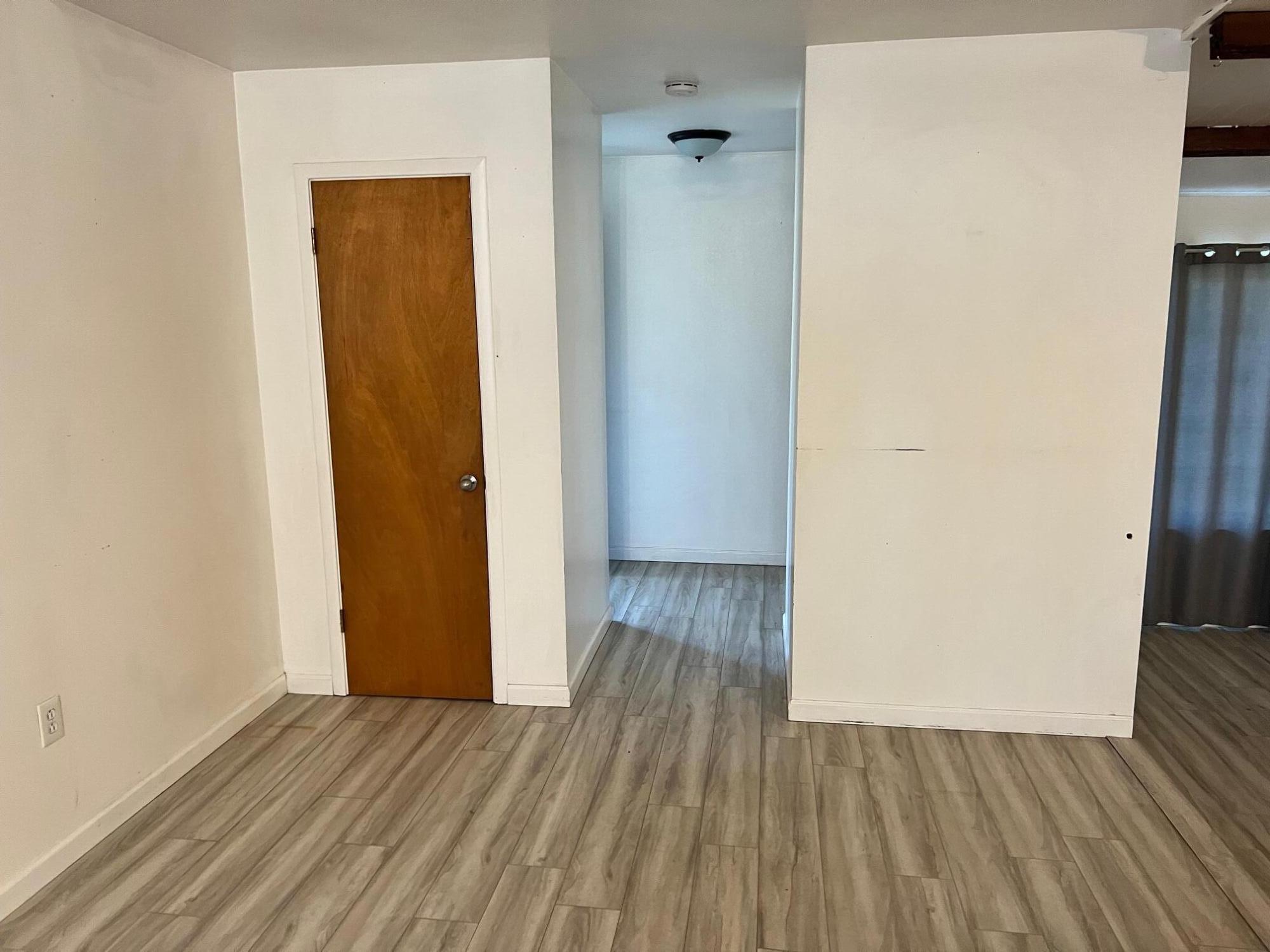 44619 Cornell Road Fall River Mills, CA 96028 - Photo 5 of 17 a view of a hallway with wooden floor