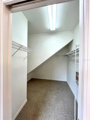 a kitchen with stainless steel appliances granite countertop a sink and a refrigerator